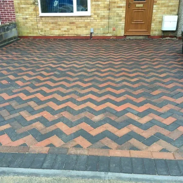 Charcoal and buff zig-zag block paving