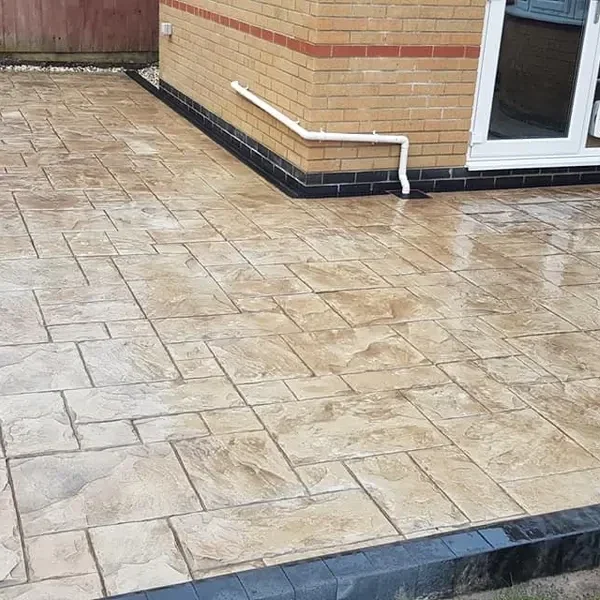 Buff imprinted concrete with a dark border