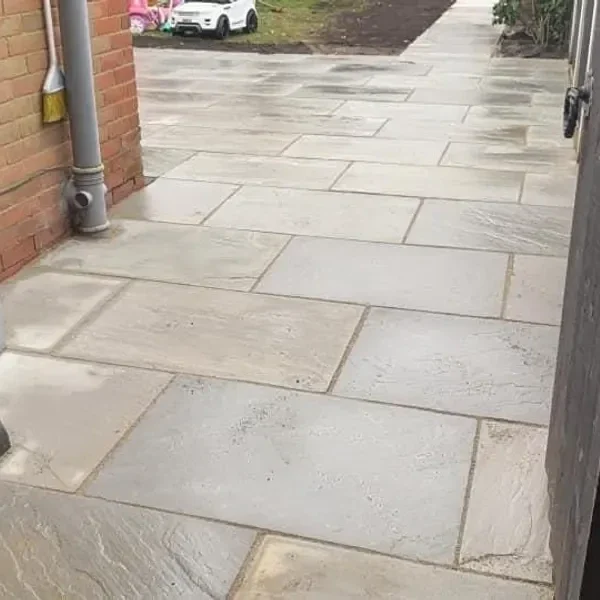 Pale slab patio with a drain
