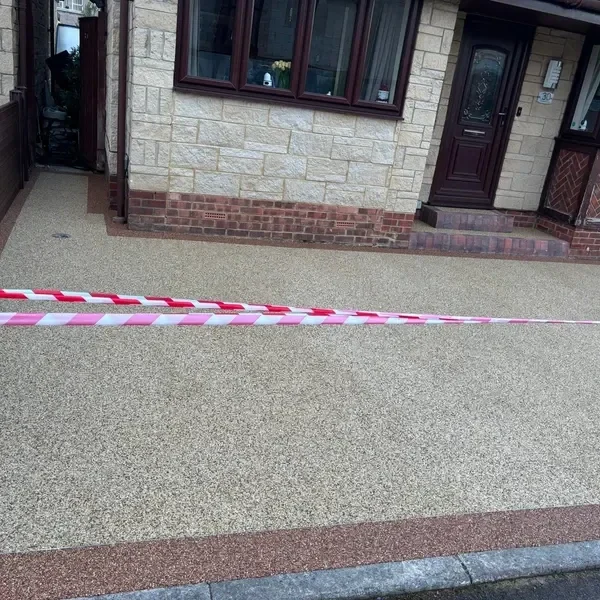 Resin bound driveway with a red block edge