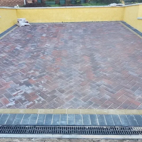 Herringbone block paving with a channel drain