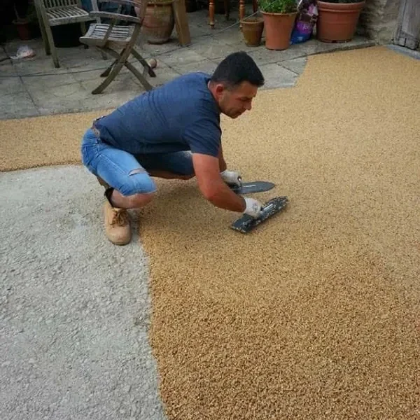 Resin bound being trowelled smooth