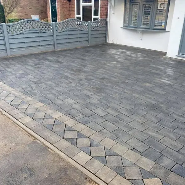 Grey block paving with a diamond border