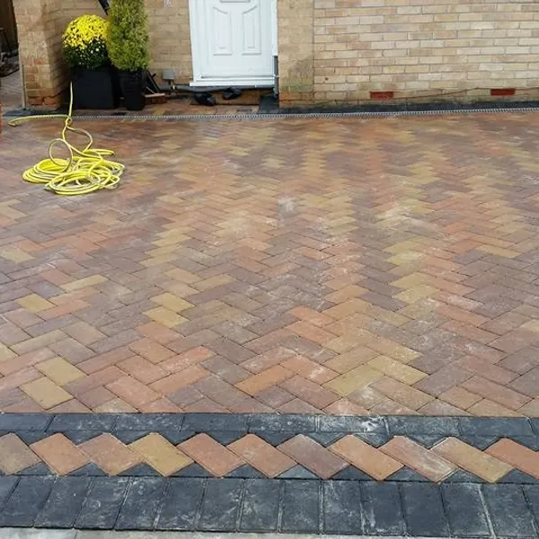 Block paving with a contrasting triangular border