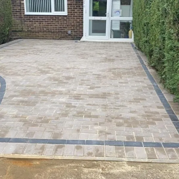 Buff block paving with a charcoal band