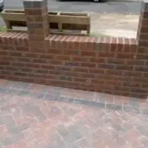 Brick boundary wall with a pier