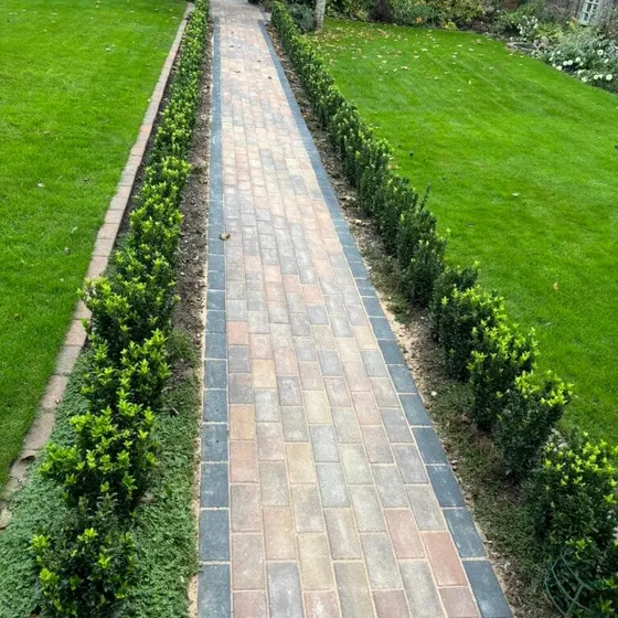 Block paved path between hedges