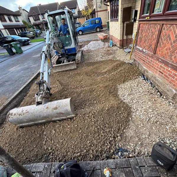 Roller compacting the sub-base
