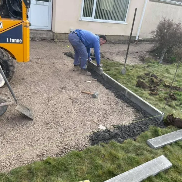 Kerbs being bedded along a new driveway