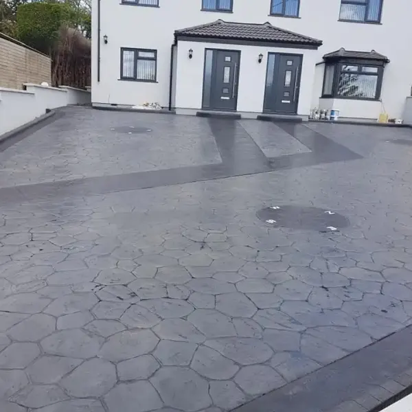 Grey stone-print imprinted concrete driveway