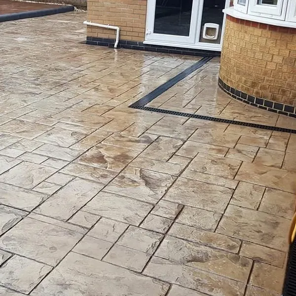 Buff ashlar-print imprinted concrete patio
