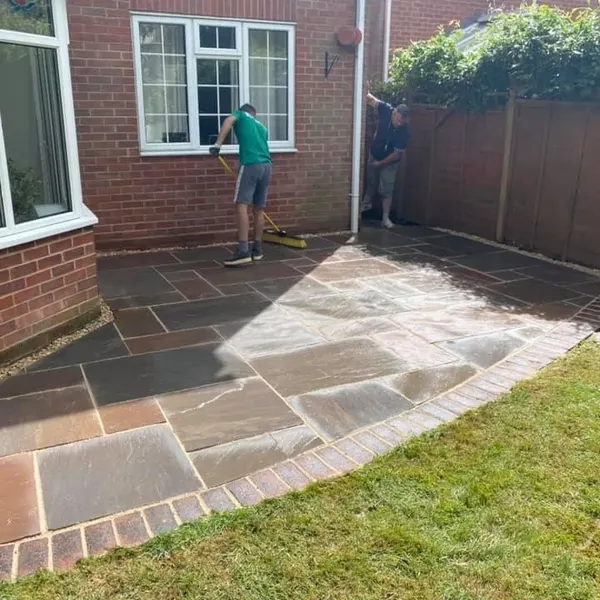 Slab patio with a curved lawn edge
