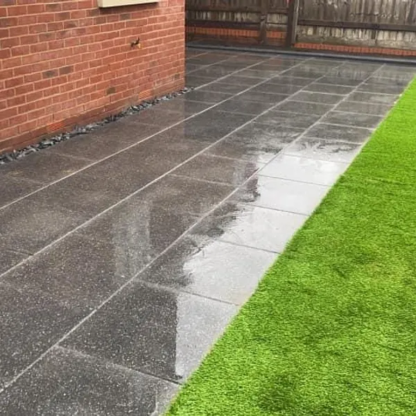 Dark slab path beside a lawn