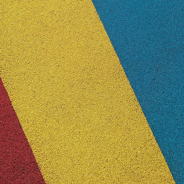 Yellow and blue wetpour play surface